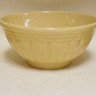 1152	LOT OF 3 EMBOSSED YELLOWARE MIXING BOWLS, LARGEST APPROXIMATELY 10 IN X 5 IN HIGH
