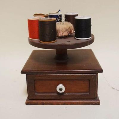 1301	PINE SEWING THREAD HOLDER W/DRAWER AT BASE, ONE SPOOL HOLDER MISSING, APPROXIMATELY 6 IN X 6 1/2 IN X 7 IN HIGH
