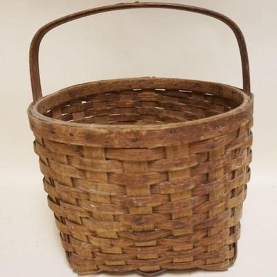 1104	LARGE ANTIQUE SPLINT WOVEN BASKET, APPROXIMATELY 15 IN X 17 IN HIGH
