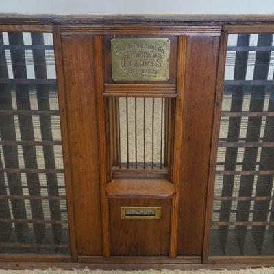 1291	ANTIQUE SADLER US POST OFFICE WINDOW FROM COUNTRY STORE W/BRASS PLATE, POSTAL CLERK WINDOW APPROXIMATELY 51 IN X 9 IN X 43 IN

