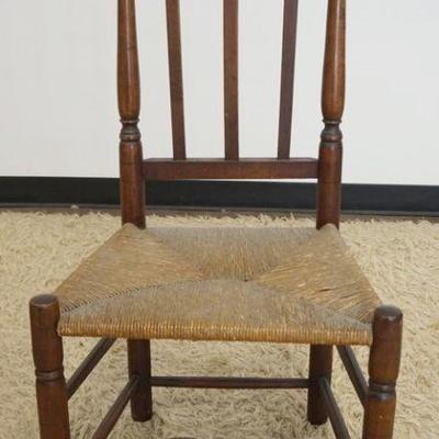 1263	ANTIQUE BANISTER BACK CHAIR W/RUSH SEAT
