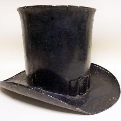 1090	LARGE ANTIQUE HAND MADE METAL TOP HAT FOR A HABERDASHERY HANGING SIGN ON STORE FRONT, HAS BUCKLE IN FRONT, APPROXIMATELY 21 IN X 25...
