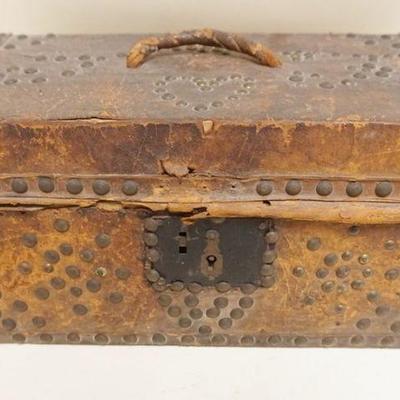 1113	SMALL PRIMITIVE LEATHER COVERED TRAVEL BOX W/BRASS TACK ACCENTS & DESIGN & PAPER LINING, APPROXIMATELY 15 IN X 8 IN X 7 IN...