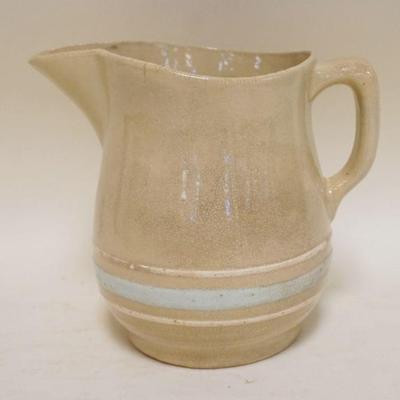 1150	YELLOWARE PITCHER W/LIGHT BLUE & CREAM BANDING, APPROXIMATELY 7 IN HIGH
