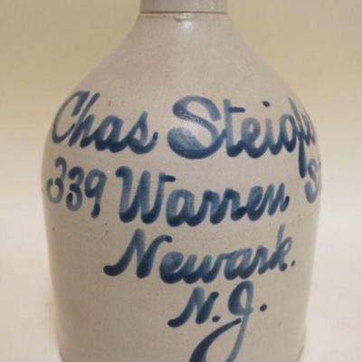 1072	BLUE SCRIPT DECORATED STONEWARE JUG, CHAS STEIGLER NEWARK NJ, APPROXIMATELY 9 IN HIGH
