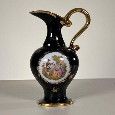LIMOGES EWER | Decorated with a courting scene, with gilt highlights. - l. 5.5 x w. 4.25 x h. 9.25 in 