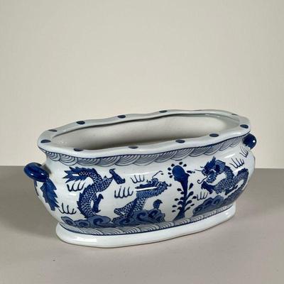 CHINESE JARDINIERE | Chinese blue and white planter decorated with dragons. - l. 15 x w. 8 x h. 6 in 