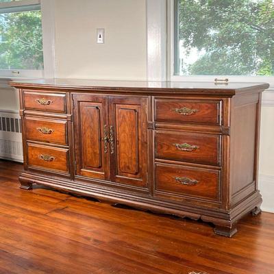 BASSETT FURNITURE DRESSER | Long dresser with two banks of three drawers centering cabinet doors before three drawers. - l. 72 x w. 21 x...