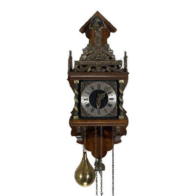 WALL CHIME CLOCK | With decorative brass mounts, the face with roman numerals, and with a digital pendulum. - l. 7.5 x w. 6 x h. 17.5 in 
