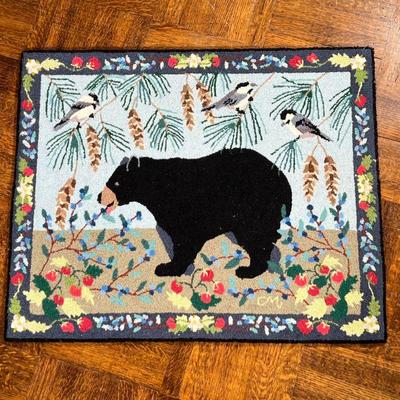 CLAIRE MURRAY HOOKED RUG | Small area rug having a black bear amongst flowers, labeled on the back. - l. 36.5 x w. 29.75 in 