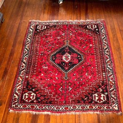 SMALL PATTERNED RUG | Area rug with center medallion on a red ground. - l. 65 x w. 48 in 