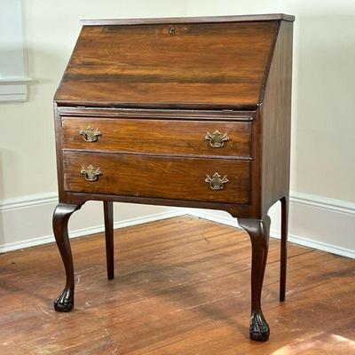 LADIES WRITING DESK | Slanted drop front over two drawers raised on cabriole legs with ball-and-claw feet. - l. 30 x w. 16 x h. 41 in 