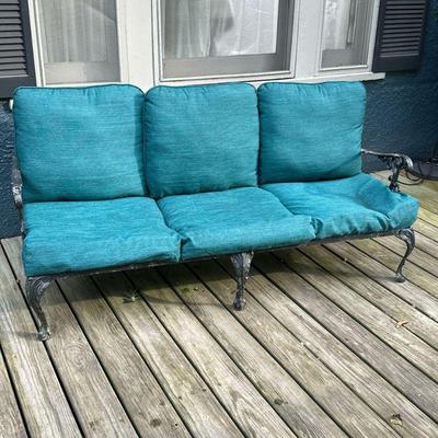  OUTDOOR 3 CUSHION COUCH | Slatted metal framed outdoor couch with wrought iron armrests and claw on ball feet. - l. 68 x w. 27 x h. 30 in 