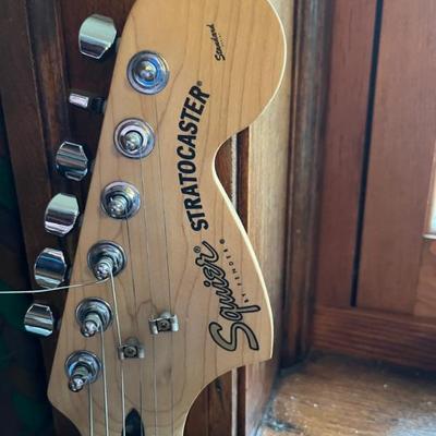 musical instruments, electric guitar by Squire, drum and amplifier by Crate