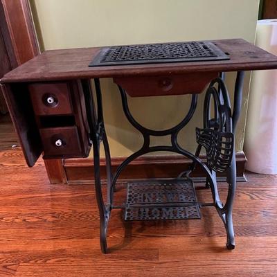 antique sewing machine table, repurposed as a great table