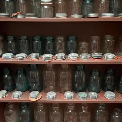 Tons of antique mason jars with glass lined, zinc lids