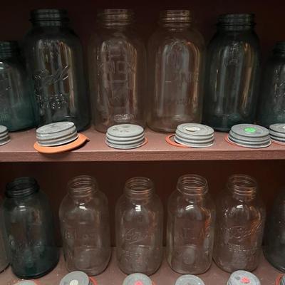 Tons of antique mason jars with glass lined, zinc lids