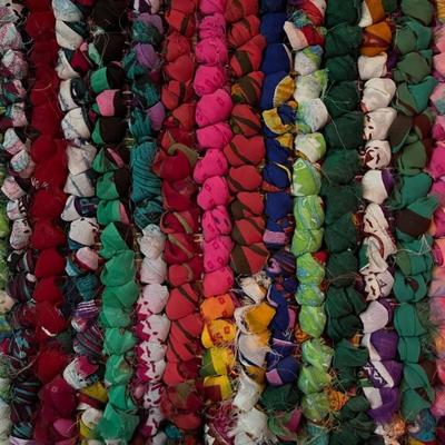 wall hanging made of braided sari scraps