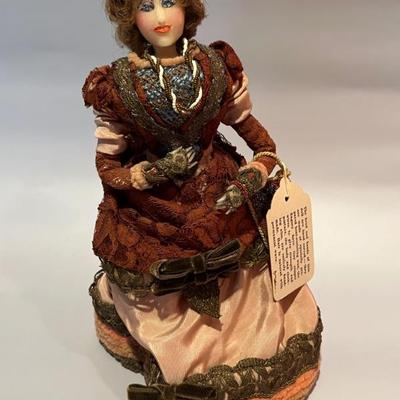 hand carved hard wax doll in a Victorian dress