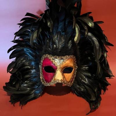 Venetian carnival mask decorated with rooster feathers