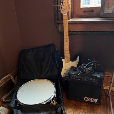 musical instruments, electric guitar by Squire, drum and amplifier by Crate