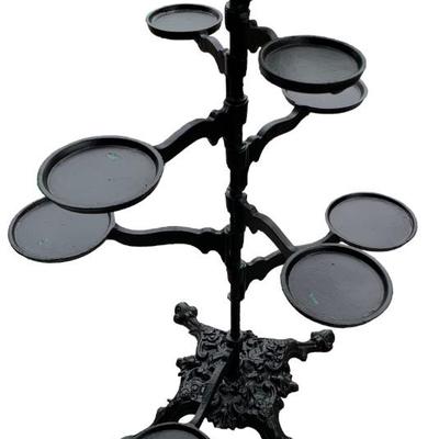 Vintage cast iron swing arm plant stand or repurposed as a dramatic candelabra.