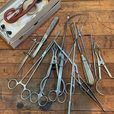 Creepy Medical & Dental Surgical tools and vintage Stethoscope in the box.