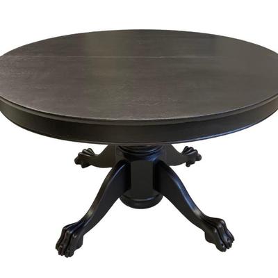 Antique 4’ Round Raven black wood claw foot table with 3 additional leaves.