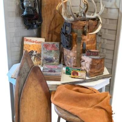 Early Hunting/Trapper magazines, old trapper backpack basket, many skinning boards and hunting accoutrements, early RR and farmhouse...
