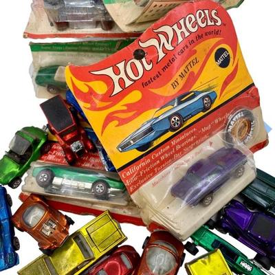 1960s NOS and used Hot Wheels Redline Cars, some with collector buttons and factory packaging