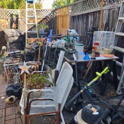birdcage, chairs, weedwacker, misc decor for your garden