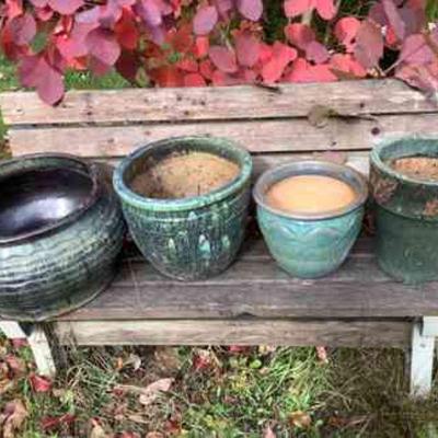 JUCR806 Ceramic Pots	Three glazed ceramic flow pots, and one glazed ceramic hose storage pot. Flowerpots measure 13' across by 11' tall,...