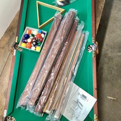 JUCR906 Half Size Pool Table	MInnesota Fats half size pool table set complete with accessories and assembly instructions. Â New, we...