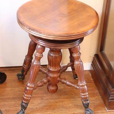Antique claw foot piano stool