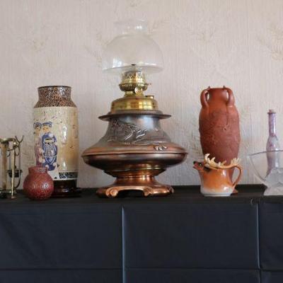 Antique copper kerosene lamp and vintage decor