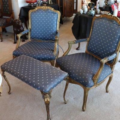 Antique arm chairs with blue upholstery and carved wood designs in Art Deco style