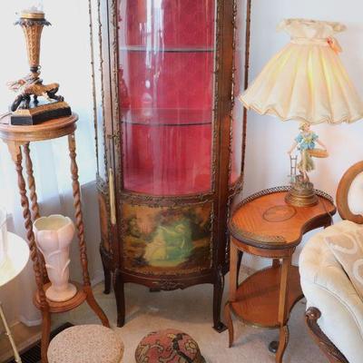 Antique Victorian era display cabinet with curved glass front. Antique plant stand. Antique foot stools.