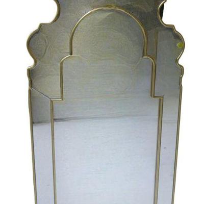 Designed by Bunny Williams. Hand cut queen anne mirror finished in gold leaf. Non-beveled center mirror surrounded by hand cut mirror. 