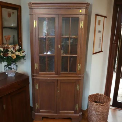 A Chippendale style corner cupboard American quality furniture maker Craftique. Solid mahogany with their Old Wood finish, brass...