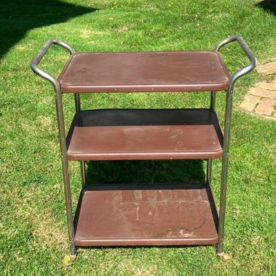 MIDCENTURY BAR CART | Nice 60â€™s Bar Cart on wheels. Stainless Steel frame with brown metal shelves. - l. 30 x w. 17 x h. 32 in
