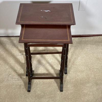 (2PC) MAHOGANY NESTING TABLES | A nice small nesting set of two mahogany tables with inlaid tops. - l. 16 x w. 10.5 x h. 22.5 in (Larger...