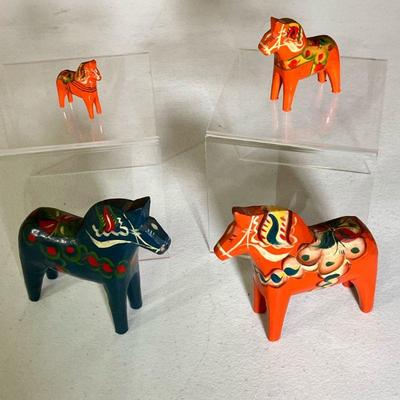 (4PC) DALA HORSES SWEDEN | A group of four Dala Horses. â€œAkta Dalahemslojd Tilly G. A. Ollson Nusnas Swedenâ€ label on all but the...