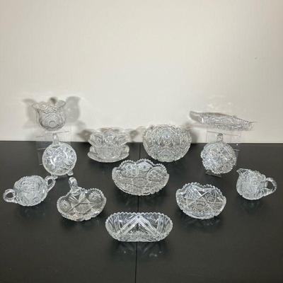 (12PC) VINTAGE CUT GLASS GROUP | Twelve pieces of Vintage Cut Glass. Group includes bowls, dishes, nappies, sugar and creamer,...