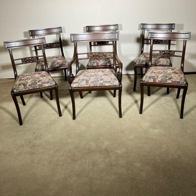 (6PC) MAHOGANY SABER LEG CHAIRS | Set of six, including one arm and five side French-style mahogany Saber leg chairs. Slip out seats....