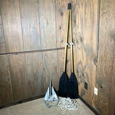 PR. BOAT OARS & ANCHOR | Pair of six foot Oars. The two piece shaft is brass with black plastic blades. Old oarlocks are attached....