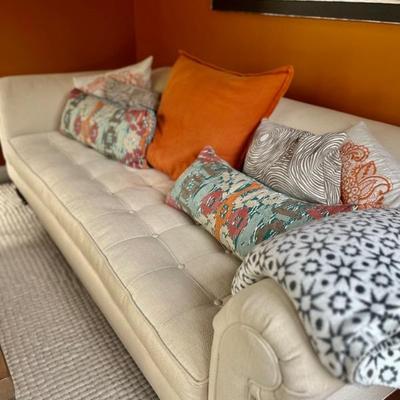 Couch is 8' 4".   Rug is 8' by 10'