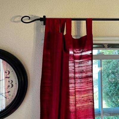 wrought iron curtain rods with red curtains 