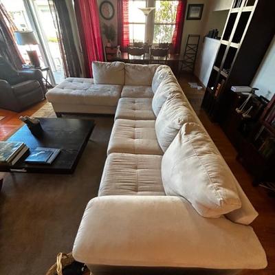 white cream sectional with pullout queen-size bed by Legget & Platt Furniture