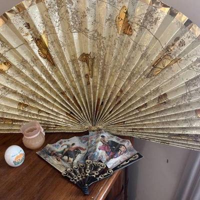 Decorative fans, egg, candle