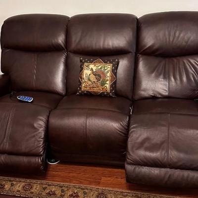 Sofa with electric recliners in either end.